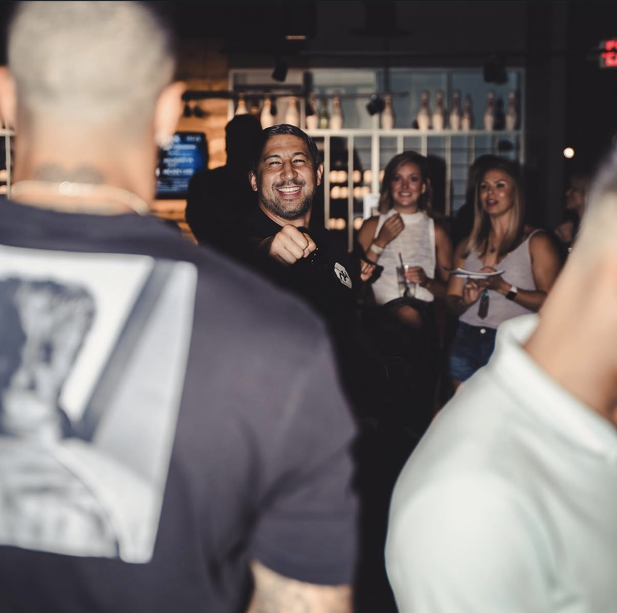 A guest laughs and celebrates on the floor at the 2019 Bowl with the Pros Charity Event.