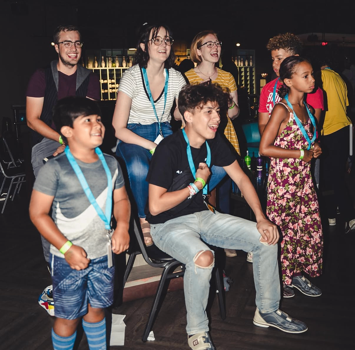 A group of youth guests cheer and celebrate a strike at the 2019 Bowl with the Pros Charity Event.