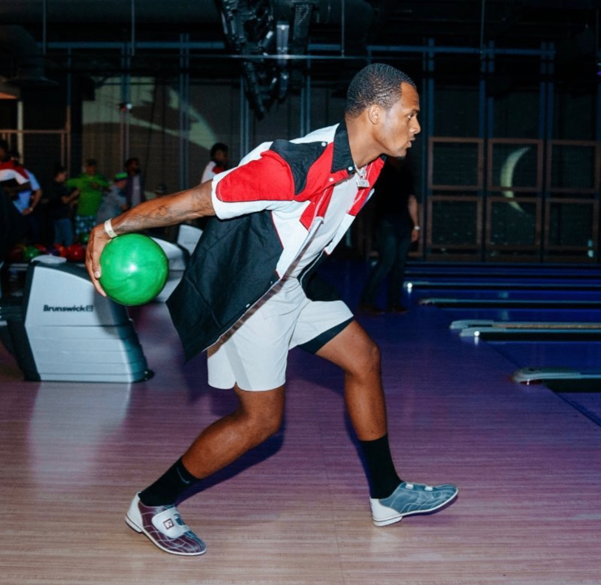 A celebrity bowler follows through after a throw during the 2018 Bowl with the Pros Charity Event.