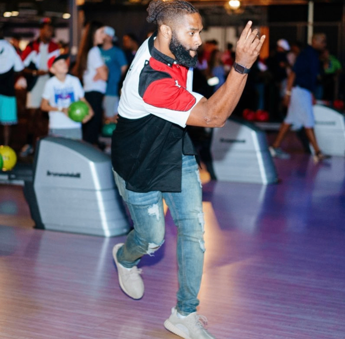 A celebrity bowler lines up a green ball on the lane during the 2018 Bowl with the Pros Charity Event.