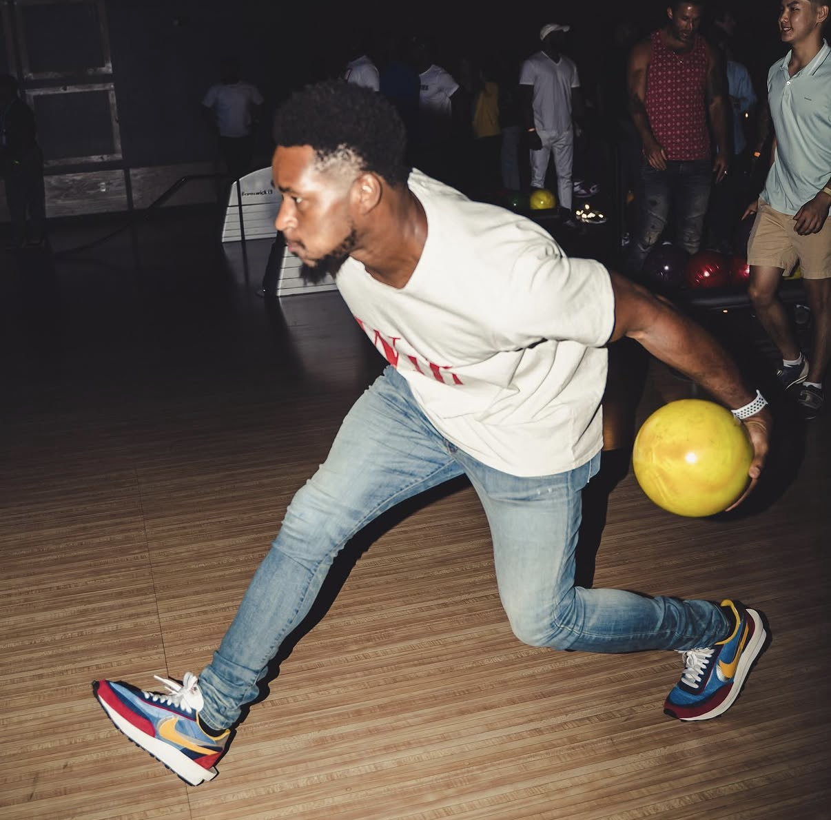 A celebrity player releases a yellow bowling ball down the lane at the 2019 Bowl with the Pros Charity Event.
