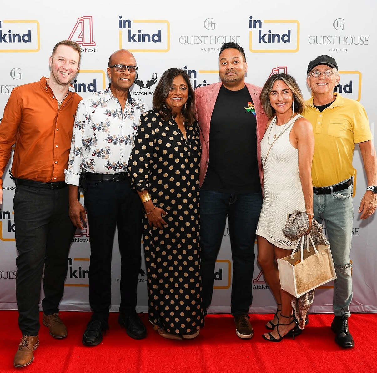 A group of guests pose together on the red carpet at the 2024 Celebrity Waiter Night.