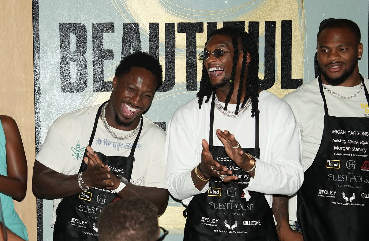 Celebrity waiters applaud together in front of the Beautiful evening backdrop at the 2026 event.