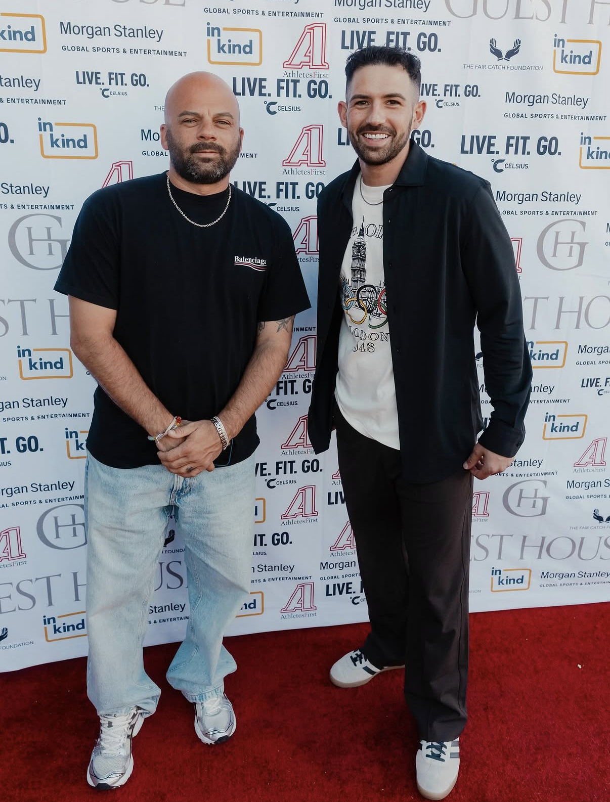 Two guests pose on the red carpet in front of the Fair Catch Foundation sponsor wall at the 2025 event.