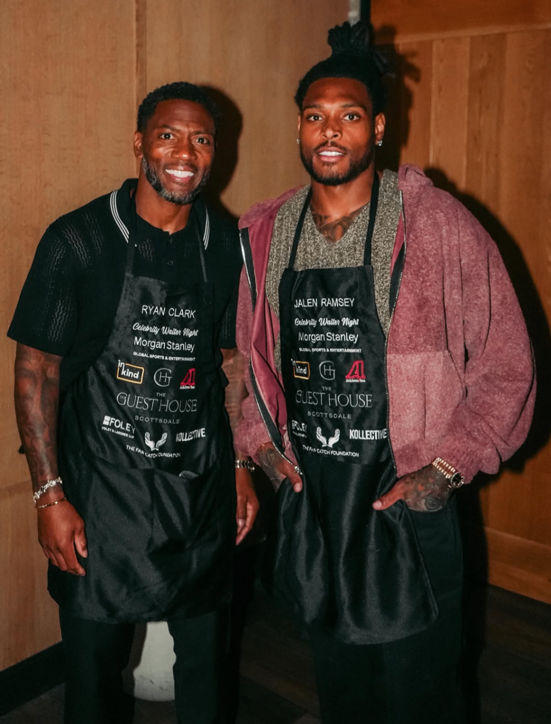 Ryan Clark and Jalen Ramsey wear their personalized Celebrity Waiter Night aprons before service in 2025.