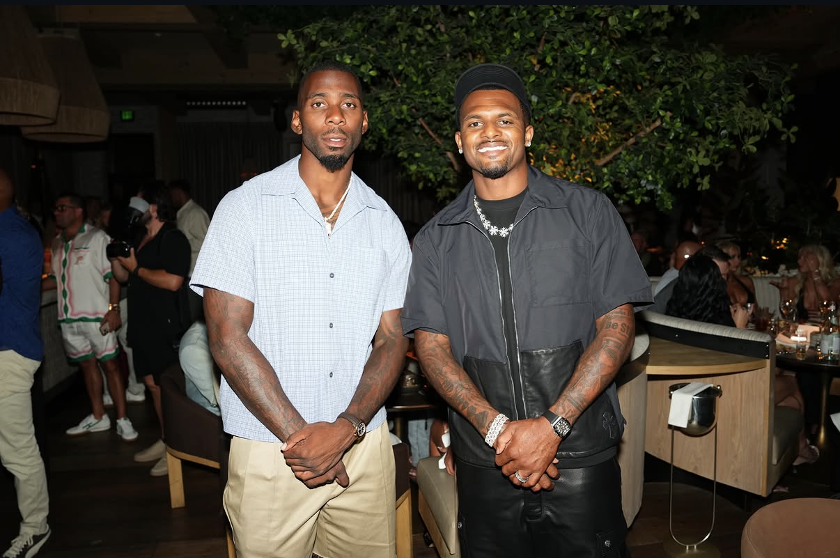 Two NFL guests pose together during the 2026 Celebrity Waiter Night.