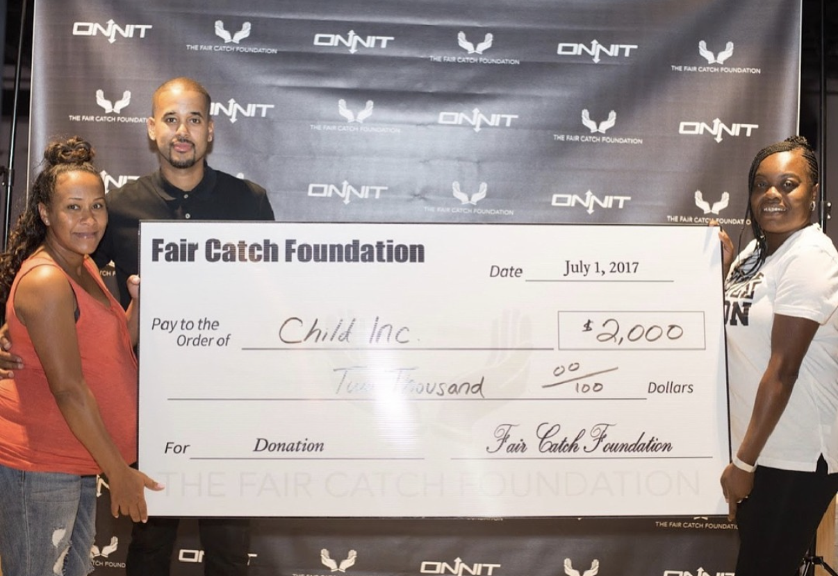 The Fair Catch Foundation presenting a $2,000 grant to Child Inc..
