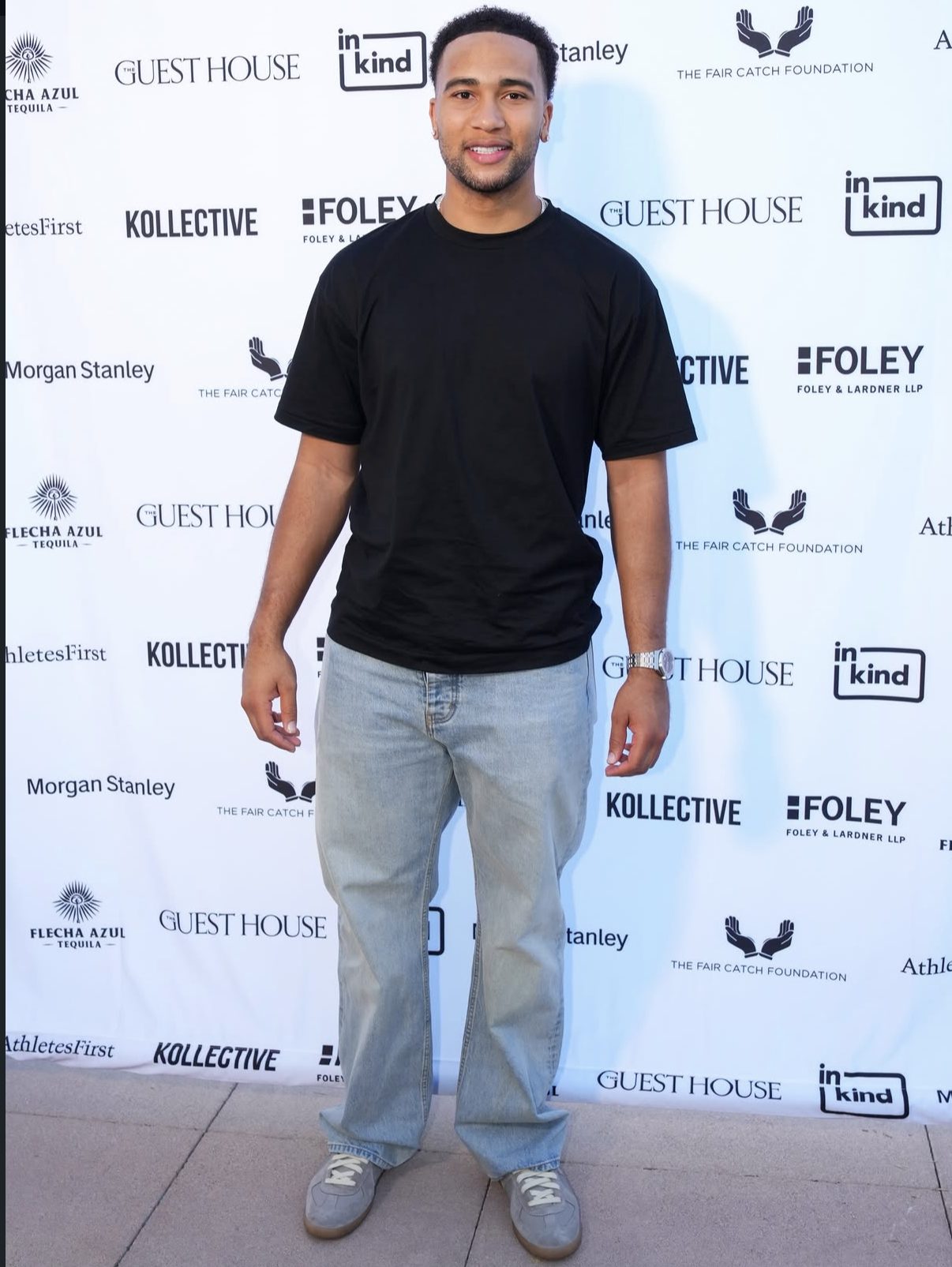 A guest poses for a full-length portrait at the 2026 Celebrity Waiter Night.