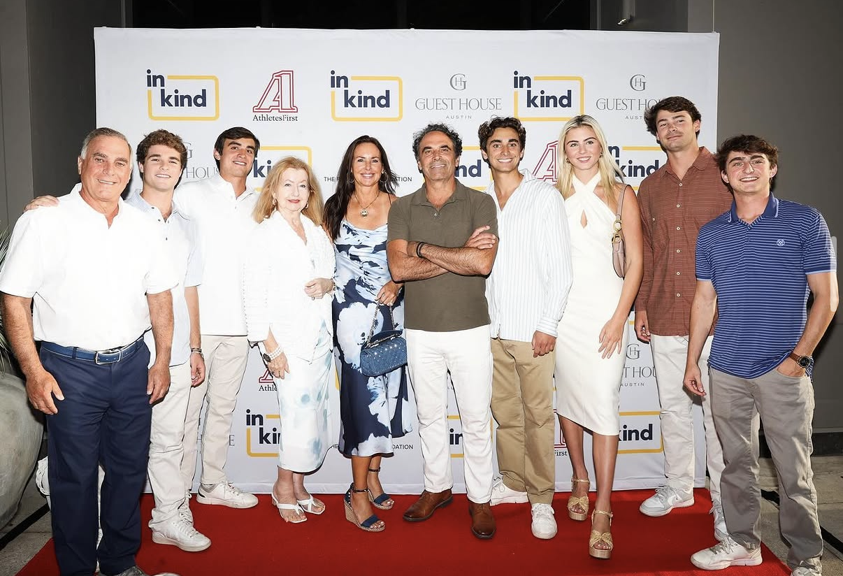 A multi-generation group portrait on the 2024 Celebrity Waiter Night red carpet.