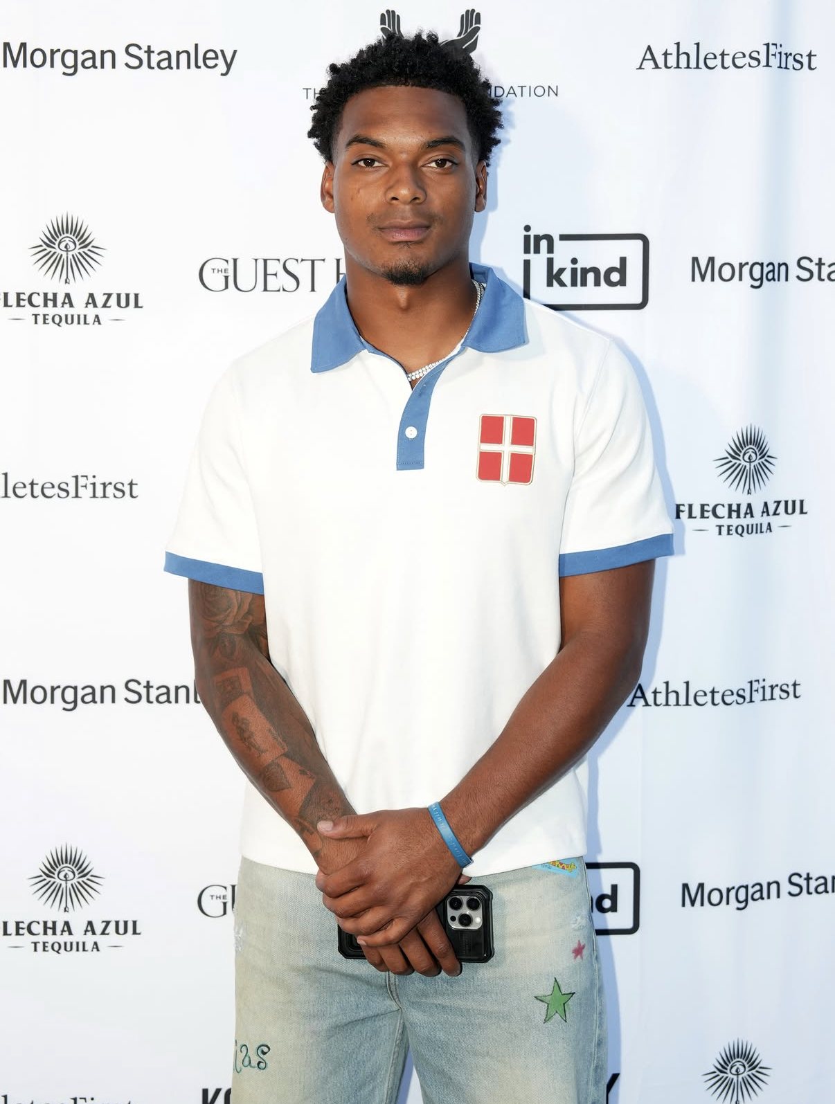 A young athlete poses on the red carpet at the 2026 Celebrity Waiter Night.