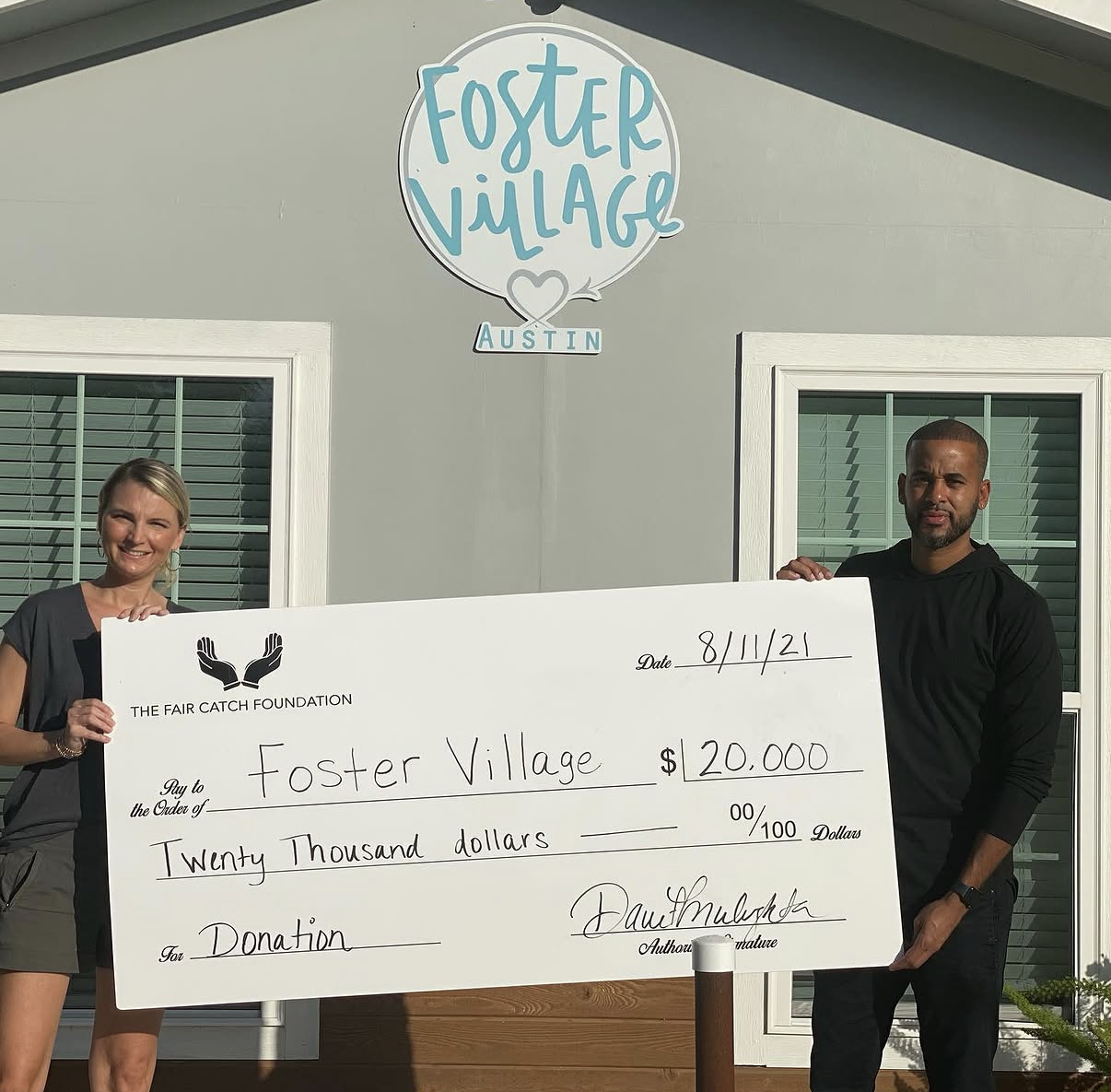 The Fair Catch Foundation presenting a $20,000 grant to Foster Village Austin.