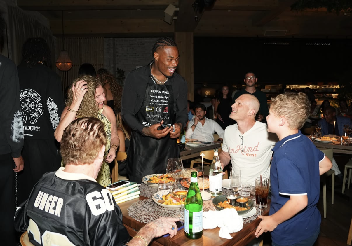 Derwin James takes an order tableside during the 2026 Celebrity Waiter Night.